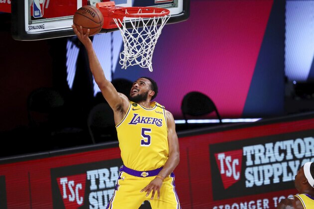 Los Angeles Lakers guard Talen Horton-Tucker (5) shoots against the Houston Rockets during the second half of an NBA basketball game Thursday, Aug. 6, 2020, in Lake Buena Vista, Fla. (Kim Klement/Pool Photo via AP)