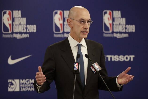 FILE - In this Oct. 8, 2019, file photo, NBA Commissioner Adam Silver speaks at a news conference before an NBA preseason basketball game between the Houston Rockets and the Toronto Raptors in Saitama, near Tokyo. It’s been over three months since the commissioners of major sports cancelled or postponed events because of the coronavirus. Enough time for us to grade them on how they’ve handled the virus so far. (AP Photo/Jae C. Hong, File)