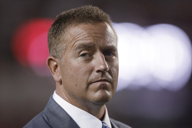 ESPN 's Kirk Herbstreit waits for an NCAA football game, Saturday, Sept. 19, 2015, in Tuscaloosa, Ala., between Alabama and Mississippi. (AP Photo/Butch Dill)