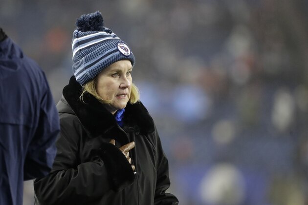 Tennessee Titans owner Amy Adams Strunk walks on the field before an NFL wild-card playoff football game against the New England Patriots, Saturday, Jan. 4, 2020, in Foxborough, Mass. (AP Photo/Steven Senne)