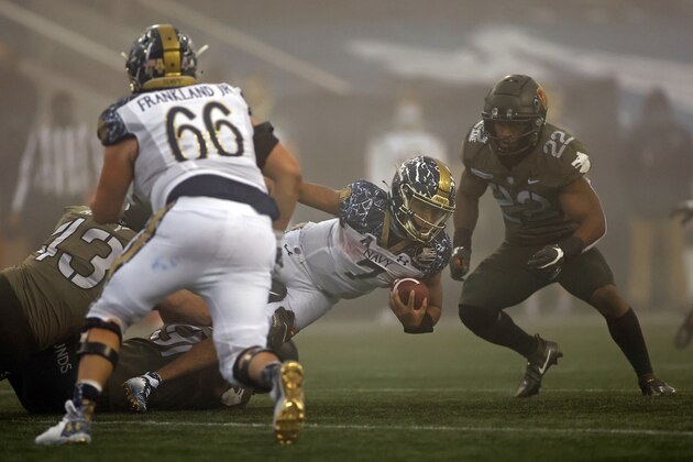Navy quarterback Xavier Arline (7) rushes during the first half of an NCAA college football game against Army on Saturday, Dec. 12, 2020, in West Point, N.Y. (AP Photo/Adam Hunger)
