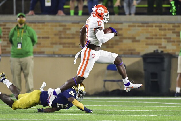 Clemson wide receiver Cornell Powell (17) runs with a reception for a touchdown as Notre Dame cornerback TaRiq Bracy (28) defends during the first quarter of an NCAA college football game Saturday, Nov. 7, 2020, in South Bend, Ind. (Matt Cashore/Pool Photo via AP) Clemson wide receiver Cornell Powell (17) runs with a reception for a touchdown as Notre Dame cornerback TaRiq Bracy (28) defends during the first quarter of an NCAA college football game Saturday, Nov. 7, 2020, in South Bend, Ind. (Matt Cashore/Pool Photo via AP)