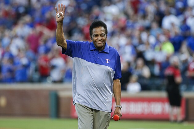 Country music singer Charley Pride waves to the crowd before signing the National Anthem before a baseball game between the New York Yankees and Texas Rangers, Saturday, April 28, 2019, in Arlington, Texas. Texas won 9-4. (AP Photo/Brandon Wade)