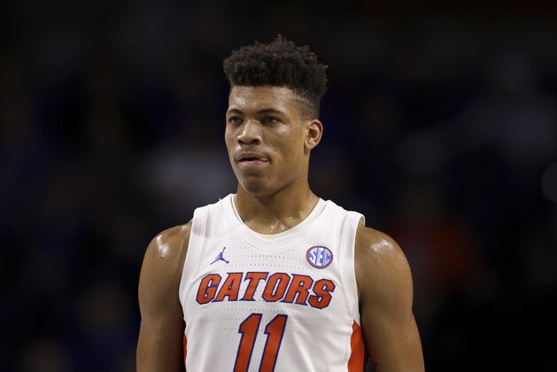 FILE - In this Nov. 29, 2019, file photo, Florida forward Keyontae Johnson (11) looks on during during the first half of an NCAA college basketball game against Marshall in Gainesville, Fla.  Johnson, the Southeastern Conference's preseason player of the year, collapsed coming out of a timeout against rival Florida State and needed emergency medical attention Saturday, Dec. 1`2, 2020. He was taken off the floor on a stretcher and rushed to Tallahassee Memorial for evaluation. The Gators had no immediate update on his condition. (AP Photo/Matt Stamey, File)