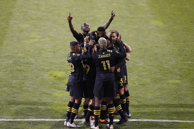 Columbus Crew players celebrate a goal against the Seattle Sounders during the first half of the MLS Championship soccer match Saturday, Dec. 12, 2020, in Columbus, Ohio. (AP Photo/Jay LaPrete)