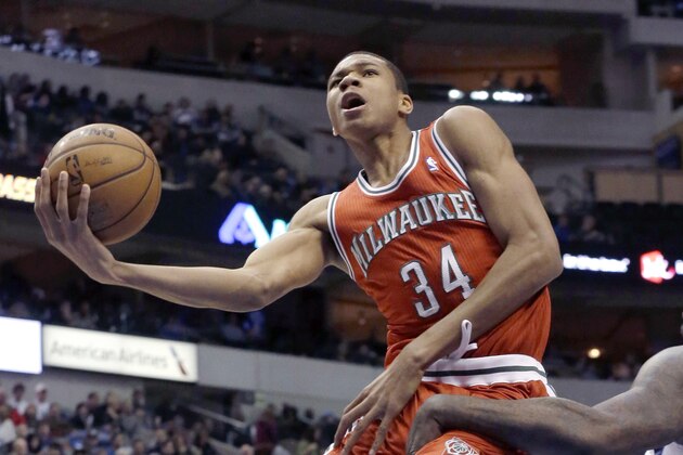 FILE - In this Dec. 14, 2013, file photo, Milwaukee Bucks shooting guard Giannis Antetokounmpo, left,, of Greece, shoots against Dallas Mavericks center DeJuan Blair (45) during the first half of an NBA basketball game in Dallas. The precocious 19-year-old rookie is providing an unexpected bright spot in an otherwise dismal season for the Bucks. (AP  Photo/LM Otero, File)