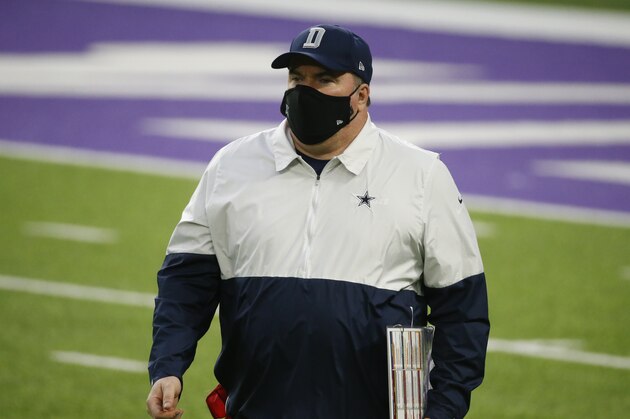 Dallas Cowboys head coach Mike McCarthy walks on the field during the first half of an NFL football game against the Minnesota Vikings, Sunday, Nov. 22, 2020, in Minneapolis. (AP Photo/Bruce Kluckhohn)
