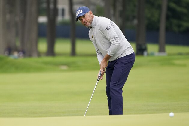 Lee Westwood, of England, putts on the fifth green during the second round of the US Open Golf Championship, Friday, Sept. 18, 2020, in Mamaroneck, N.Y. (AP Photo/John Minchillo)