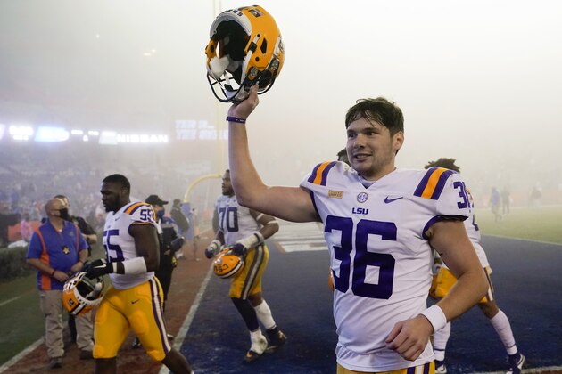 LSU's Cade York (36) celebrates as he comes off the field after kicking a field goal against Florida in the final minute of an NCAA college football gam  Saturday, Dec. 12, 2020, in Gainesville, Fla. LSU won 37-34. (AP Photo/John Raoux)