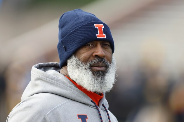 FILE - In this Nov. 23, 2019, file photo, Illinois head coach Lovie Smith walks on the field before an NCAA college football game against Iowa, in Iowa City, Iowa. Even after beating a Wisconsin team that was favored by 30 ½ points last year, Illinois heads into Madison as a 19 ½-point underdog as the two West Division rivals prepare to open the pandemic-delayed Big Ten season Friday night. (AP Photo/Charlie Neibergall, File)