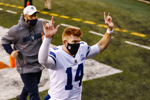 Dallas Cowboys quarterback Andy Dalton (14) runs off the field following an NFL football game against the Cincinnati Bengals in Cincinnati, Sunday, Dec. 13, 2020. The Cowboys defeated the Bengals 30-7. (AP Photo/Aaron Doster)