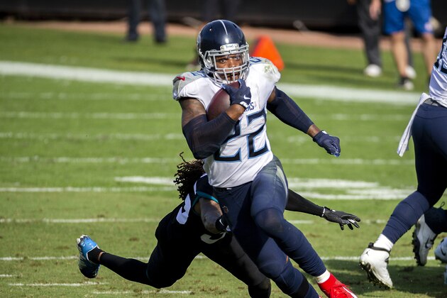 Tennessee Titans running back Derrick Henry (22) gains yardage as he tries to get around Jacksonville Jaguars cornerback Sidney Jones (35) during the first half of an NFL football game, Sunday, Dec. 13, 2020, in Jacksonville, Fla. (AP Photo/Stephen B. Morton)
