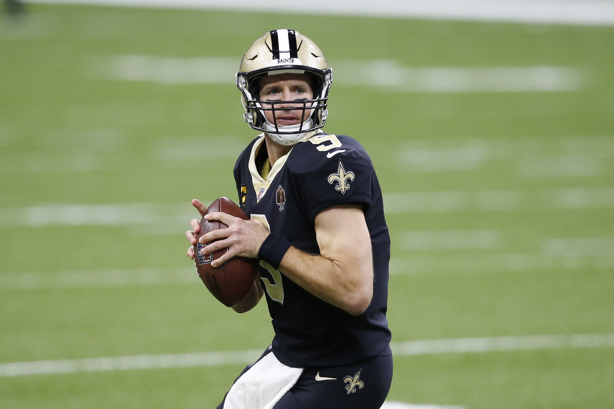 New Orleans Saints quarterback Drew Brees (9) warms up before an NFL football game against the San Francisco 49ers in New Orleans, Sunday, Nov. 15, 2020. (AP Photo/Butch Dill)