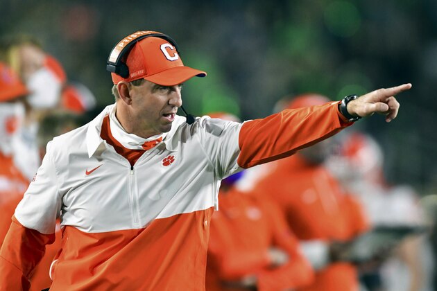 FILE - In this Saturday, Nov. 7, 2020, file photo, Clemson coach Dabo Swinney signals to his players during the second quarter against Notre Dame in an NCAA college football game in South Bend, Ind. Swinney has been critical of Florida State after last weekend's Clemson-FSU game was postponed due to coronavirus concerns. (Matt Cashore/Pool Photo via AP, File)