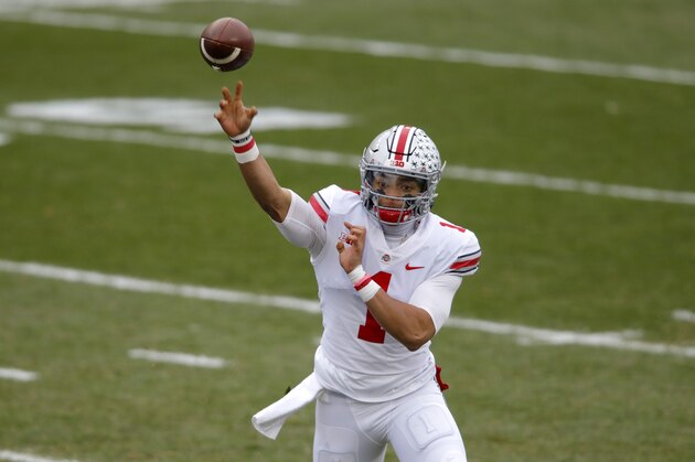 Ohio State quarterback Justin Fields throws a pass during an NCAA college football game against Michigan State, Saturday, Dec. 5, 2020, in East Lansing, Mich. Ohio State won 52-12. (AP Photo/Al Goldis)