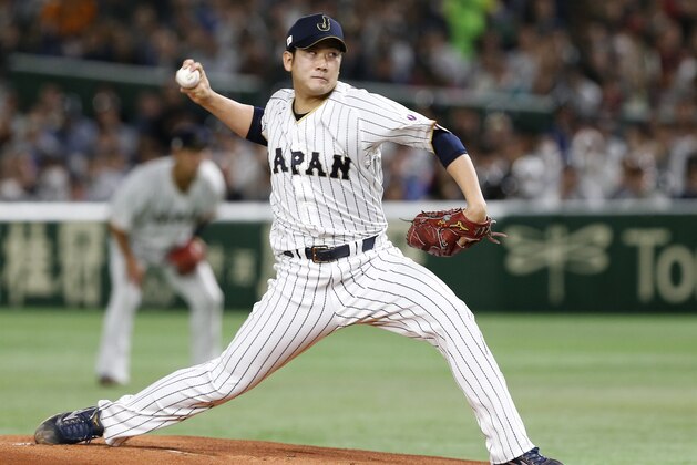 FILE - In this March 14, 2017, file photo, Japan starting pitcher Tomoyuki Sugano throws to a Cuba batter during the first inning of a second-round game at the World Baseball Classic in Tokyo. Japanese star pitcher Tomoyuki Sugano has been posted by the Yomiuri Giants and is available for bidding to major league teams. The bidding starts at 8 a.m. EST Tuesday, Dec. 8, 2020 and runs through 5 p.m. EST on Jan. 7. (AP Photo/Toru Takahashi, File)