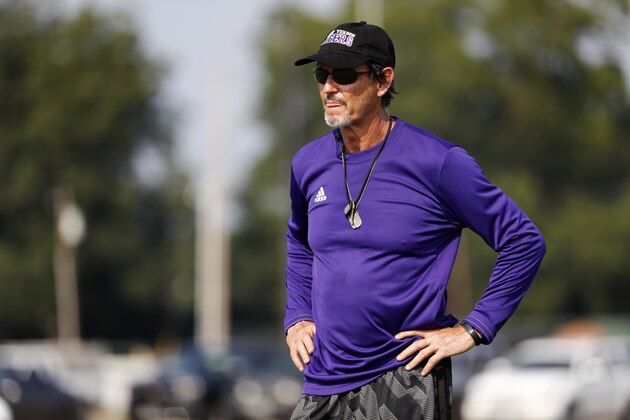 Coach Art Briles watches his team practice at Mount Vernon High School, Monday, Aug. 5, 2019, in Mount Vernon, Texas. Briles was back at his roots Monday, coaching a high school football team in Texas after a season in Italy and more than three years after the two-time Big 12 champion coach was fired by Baylor in the wake of a sexual assault scandal. (AP Photo/Tony Gutierrez)