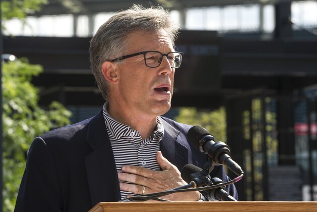Cleveland Indians president Paul Dolan speaks at the unveiling of a statue honoring Indians Hall of Fame coach and player Lou Boudreau before a baseball game against the New York Yankees in Cleveland, Saturday, Aug. 5, 2017. (AP Photo/Phil Long)