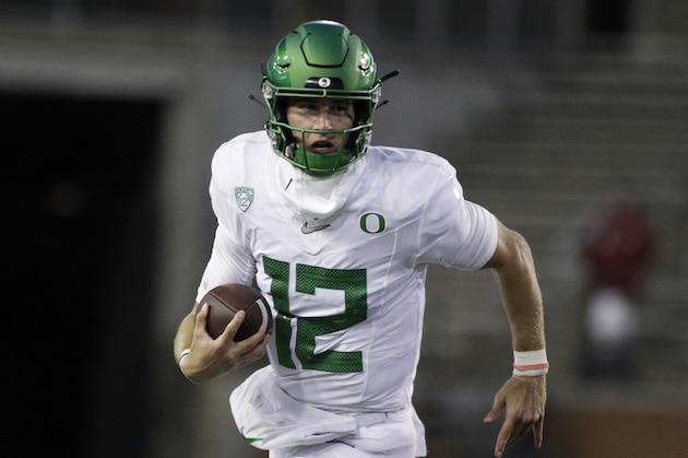 Oregon quarterback Tyler Shough carries the ball during the second half of the team's NCAA college football game against Washington State in Pullman, Wash., Saturday, Nov. 14, 2020. Oregon won 43-29. (AP Photo/Young Kwak)