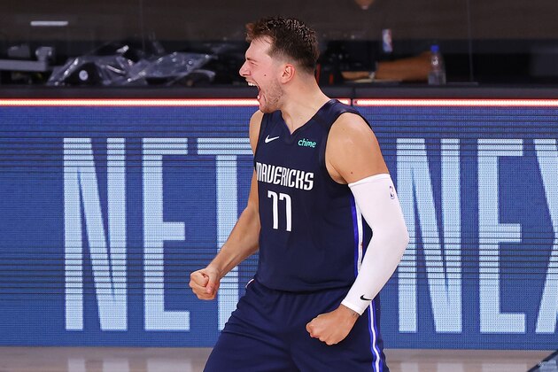 Luka Doncic of the Dallas Mavericks celebrates his game-winning three-point basket against the Los Angeles Clippers during overtime of Game 4 of an NBA basketball first-round playoff series, Sunday, Aug. 23, 2020, in Lake Buena Vista, Fla. (Kevin C. Cox/Pool Photo via AP) Luka Doncic of the Dallas Mavericks celebrates his game-winning three-point basket against the Los Angeles Clippers during overtime of Game 4 of an NBA basketball first-round playoff series, Sunday, Aug. 23, 2020, in Lake Buena Vista, Fla. (Kevin C. Cox/Pool Photo via AP)