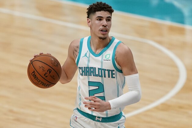 Charlotte Hornets guard LaMelo Ball plays against the Toronto Raptors during the second half of an NBA preseason basketball game in Charlotte, N.C. on Saturday, Dec. 12, 2020. (AP Photo/Chris Carlson)