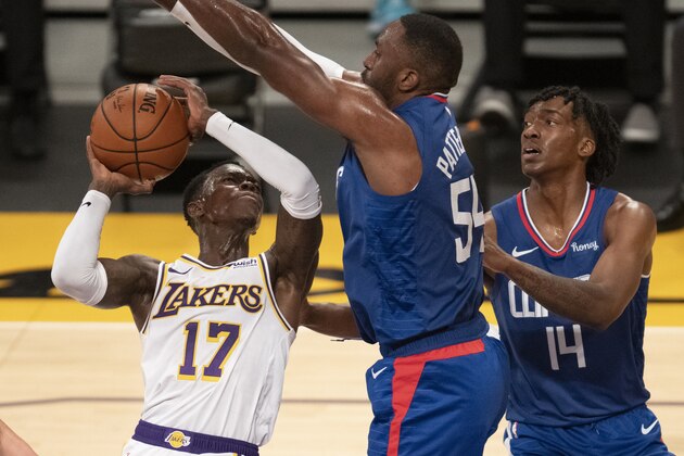 Los Angeles Lakers guard Dennis Schroeder, left, goes up for a shot as Los Angeles Clippers forward Patrick Patterson, center, defends during the second half of an NBA preseason basketball game in Los Angeles, Friday, Dec. 11, 2020. (AP Photo/Kyusung Gong)