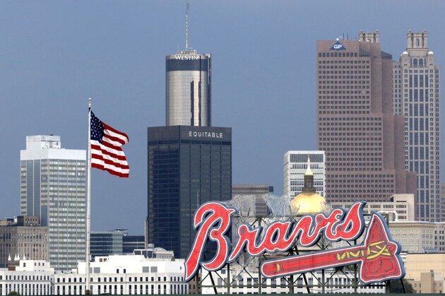 The Atlanta city skyline with the Braves logo before a baseball game between the San Francisco Giants and the Atlanta Braves, Wednesday, June 1, 2016, in Atlanta. (AP Photo/Butch Dill)