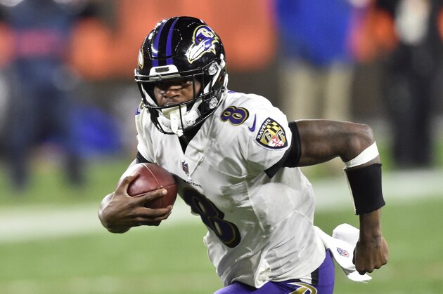 Baltimore Ravens quarterback Lamar Jackson (8) rushes for a 17-yard touchdown during the first half of an NFL football game against the Cleveland Browns, Monday, Dec. 14, 2020, in Cleveland. (AP Photo/David Richard)