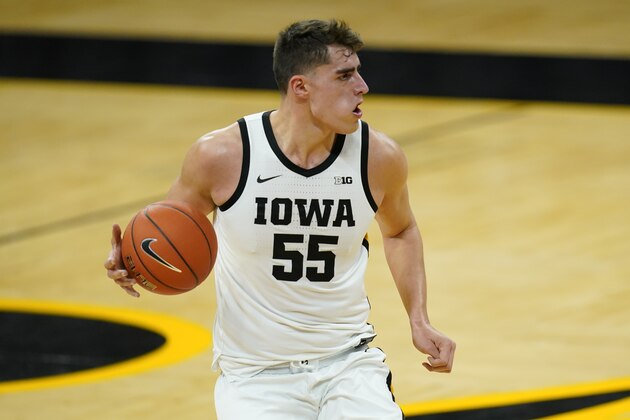 Iowa center Luka Garza drives up court during the first half of an NCAA college basketball game against Northern Illinois, Sunday, Dec. 13, 2020, in Iowa City, Iowa. (AP Photo/Charlie Neibergall)