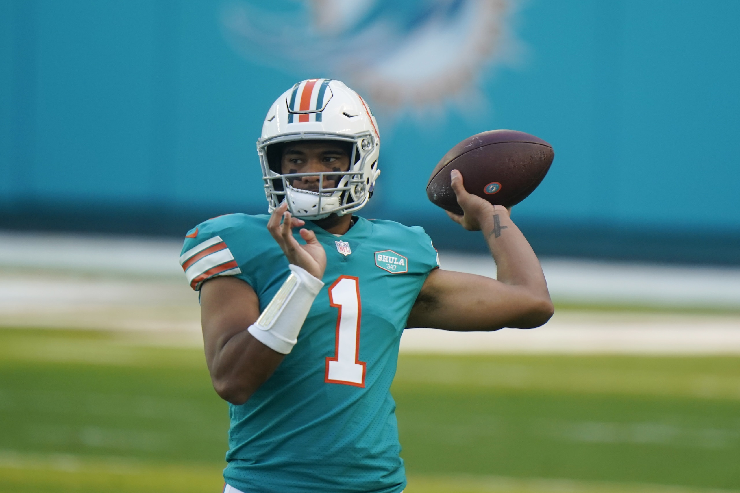 Miami Dolphins quarterback Tua Tagovailoa (1) warms up before an NFL football game Kansas City Chiefs, Sunday, Dec. 13, 2020, in Miami Gardens, Fla. (AP Photo/Wilfredo Lee) Miami Dolphins quarterback Tua Tagovailoa (1) warms up before an NFL football game Kansas City Chiefs, Sunday, Dec. 13, 2020, in Miami Gardens, Fla. (AP Photo/Wilfredo Lee)