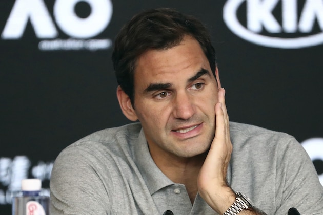 Switzerland's Roger Federer speaks during a press conference following his semifinal loss to Serbia's Novak Djokovic at the Australian Open tennis championship in Melbourne, Australia, Thursday, Jan. 30, 2020. (AP Photo/Dita Alangkara)