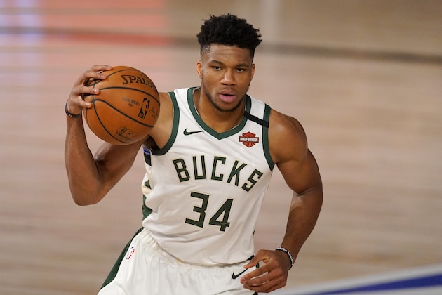 Milwaukee Bucks' Giannis Antetokounmpo handles the ball during the second half of an NBA basketball conference semifinal playoff game against the Miami Heat on Monday, Aug. 31, 2020, in Lake Buena Vista, Fla. (AP Photo/Mark J. Terrill)