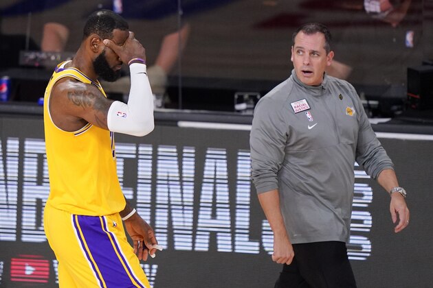 Los Angeles Lakers forward LeBron James, left, reacts as head coach Frank Vogel looks on during the second half in Game 4 of basketball's NBA Finals against the Miami Heat Tuesday, Oct. 6, 2020, in Lake Buena Vista, Fla. (AP Photo/Mark J. Terrill)
