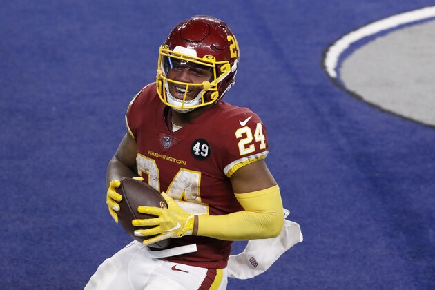 Washington Football Team's Antonio Gibson smiles after his touchdown run in the second half of an NFL football game against the Dallas Cowboys in Arlington, Texas, Thursday, Nov. 26, 2020. (AP Photo/Roger Steinman)