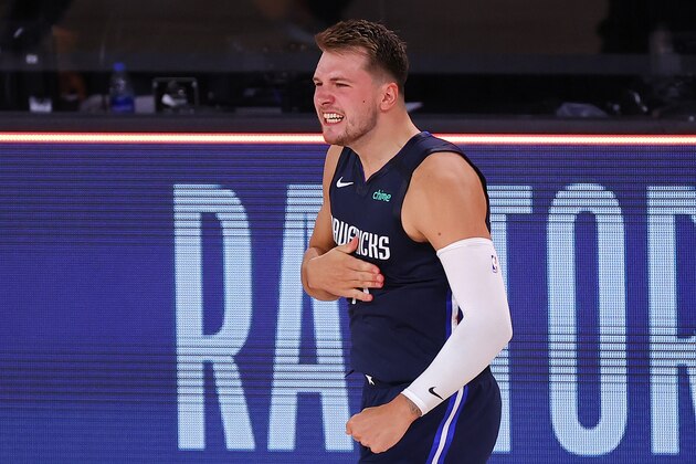 Luka Doncic of the Dallas Mavericks celebrates his game-winning three-point basket against the Los Angeles Clippers during overtime of Game 4 of an NBA basketball first-round playoff series, Sunday, Aug. 23, 2020, in Lake Buena Vista, Fla. (Kevin C. Cox/Pool Photo via AP)