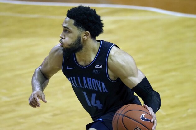Villanova guard Caleb Daniels dribbles the ball during the first half of an NCAA college basketball game against Texas, Sunday, Dec. 6, 2020, in Austin, Texas. (AP Photo/Michael Thomas)