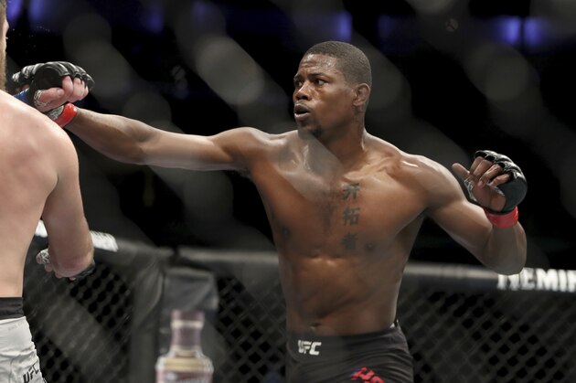 Kevin Holland, right, in action against Gerald Meerschaert during their mixed martial arts bout at UFC Fight Night, Saturday, March 30, 2019, in Philadelphia. Holland won via decision. (AP Photo/Gregory Payan)