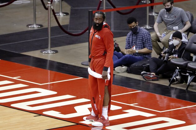 Houston Rockets guard James Harden leaves the court after their win against the San Antonio Spurs after an NBA basketball game Tuesday, Dec. 15, 2020, in Houston. (AP Photo/Michael Wyke)