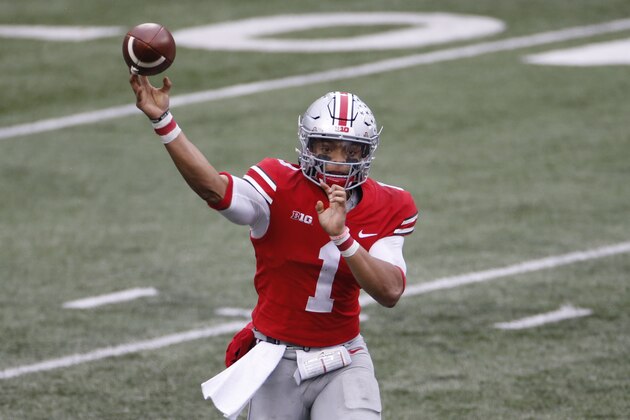 Ohio State quarterback Justin Fields throws a pass against Indiana during the second half of an NCAA college football game Saturday, Nov. 21, 2020, in Columbus, Ohio. Ohio State beat Indiana 42-35. (AP Photo/Jay LaPrete)