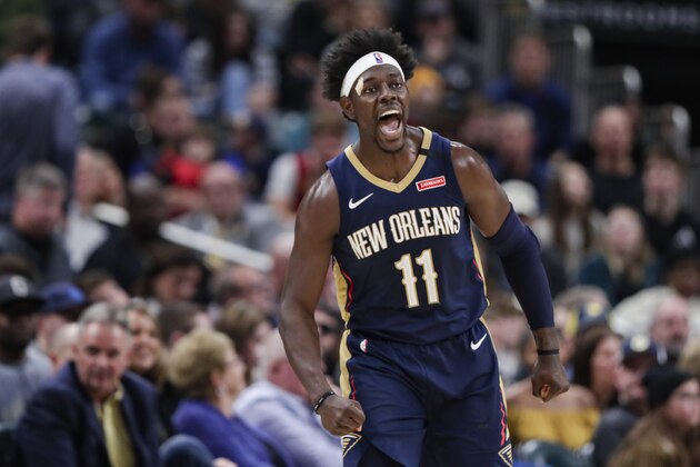 FILE - Then-New Orleans Pelicans guard Jrue Holiday celebrates a 3-point basket late in the second half of the team's NBA basketball game against the Indiana Pacers in Indianapolis, in this Saturday, Feb. 8, 2020, file photo. The Bucks paid a hefty price to acquire guard Jrue Holiday to join a nucleus that includes Giannis Antetokounmpo and All-Star forward Khris Middleton as they try to erase the postseason disappointment of the last two years.  (AP Photo/Michael Conroy, File)