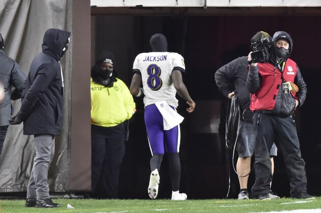 Baltimore Ravens quarterback Lamar Jackson (8) runs to the locker room during the second half of an NFL football game against the Cleveland Browns, Monday, Dec. 14, 2020, in Cleveland. (AP Photo/David Richard)