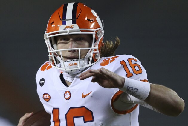 Clemson's Trevor Lawrence runs for a touchdown against Virginia Tech during the third quarter of an NCAA college football game Saturday, Dec. 5, 2020, in Blacksburg, Va. (Matt Gentry/The Roanoke Times via AP, Pool)