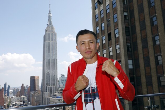 Kazakhstan's Gennady Golovkin poses for photos after a news conference at New York's Madison Square Garden, Thursday, Aug. 22, 2019. (AP Photo/Richard Drew)
