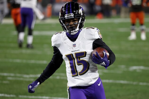 Baltimore Ravens wide receiver Marquise Brown (15) runs with the ball during an NFL football game against the Cleveland Browns, Monday, Dec. 14, 2020, in Cleveland. (AP Photo/Kirk Irwin)
