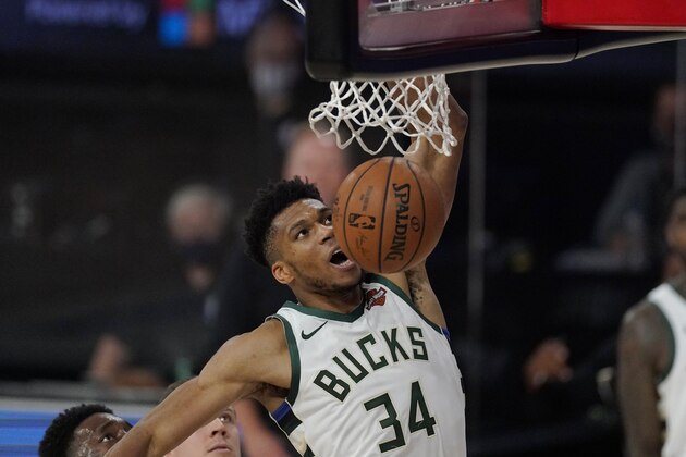 Milwaukee Bucks' Giannis Antetokounmpo (34) dunks in the second half of an NBA conference semifinal playoff basketball game against the Miami Heat Friday, Sept. 4, 2020, in Lake Buena Vista, Fla. (AP Photo/Mark J. Terrill)