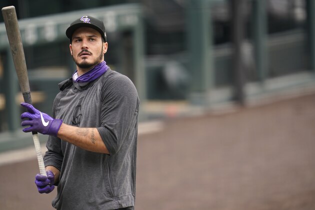 Colorado Rockies' Nolan Arenado warms up before a baseball game against the Los Angeles Dodgers, Saturday, Sept. 19, 2020, in Denver. (AP Photo/David Zalubowski)