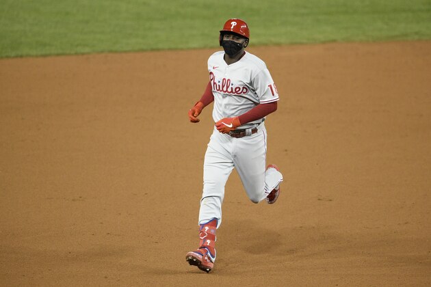 Philadelphia Phillies' Didi Gregorius celebrates and rounds the bases on his three-run home run as he rounds the bases during the ninth inning of a baseball game against the Washington Nationals, Wednesday, Sept. 23, 2020, in Washington. (AP Photo/Nick Wass)