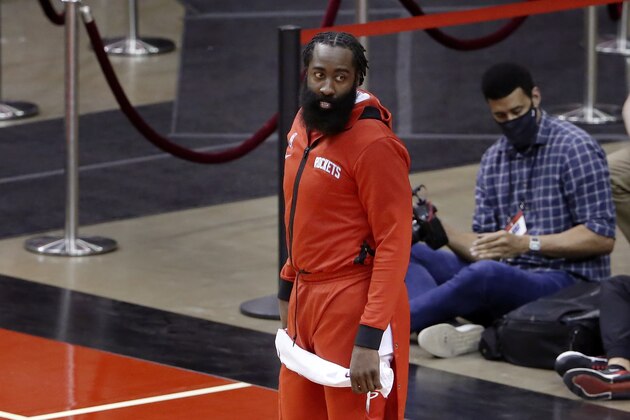 Houston Rockets guard James Harden leaves the court after their win against the San Antonio Spurs after an NBA basketball game Tuesday, Dec. 15, 2020, in Houston. (AP Photo/Michael Wyke)