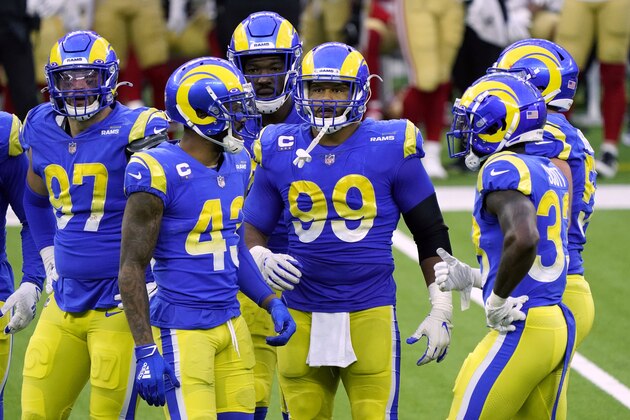Los Angeles Rams defensive end Aaron Donald (99), and teammates in a break in the action during the second half of an NFL football game against the San Francisco 49ers Sunday, Nov. 29, 2020, in Inglewood, Calif. (AP Photo/Alex Gallardo)