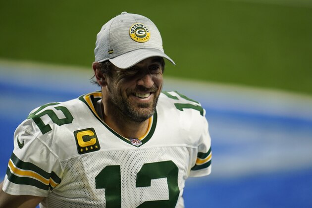 Green Bay Packers quarterback Aaron Rodgers walks off the field after an NFL football game against the Detroit Lions, Sunday, Dec. 13, 2020, in Detroit. (AP Photo/Paul Sancya)